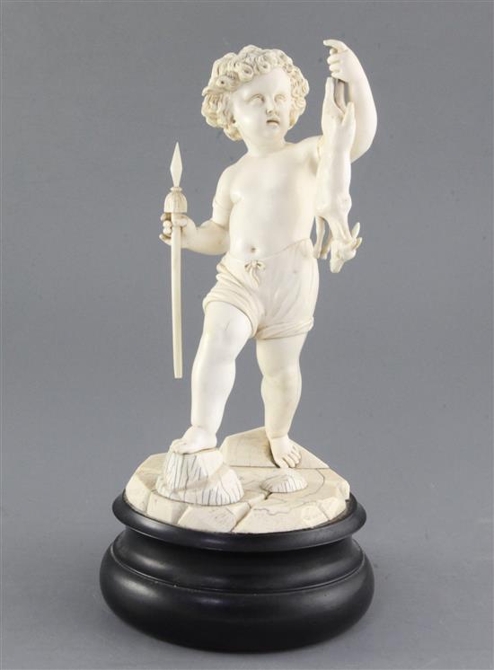 A 19th century Dieppe carved ivory figure of a putto holding a dead deer, height 12in.